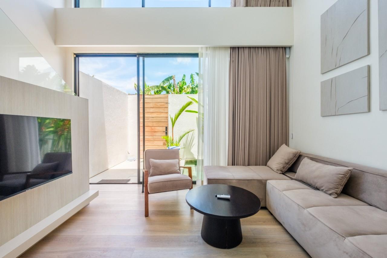 Living room with a seating area and TV