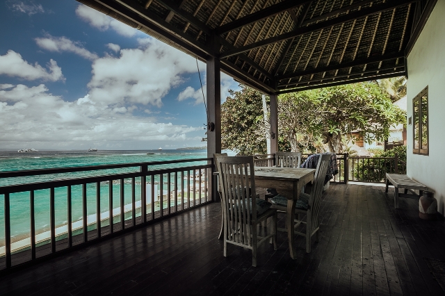 A room in a separate building by the pool with panoramic ocean views