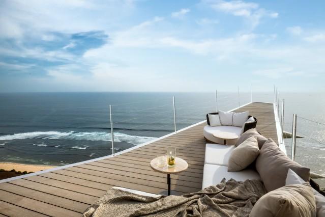 Sitting area on the wing of the plane with ocean view 